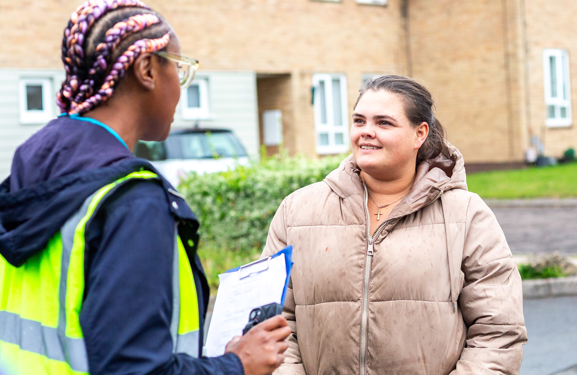 Two people stood in the street talking