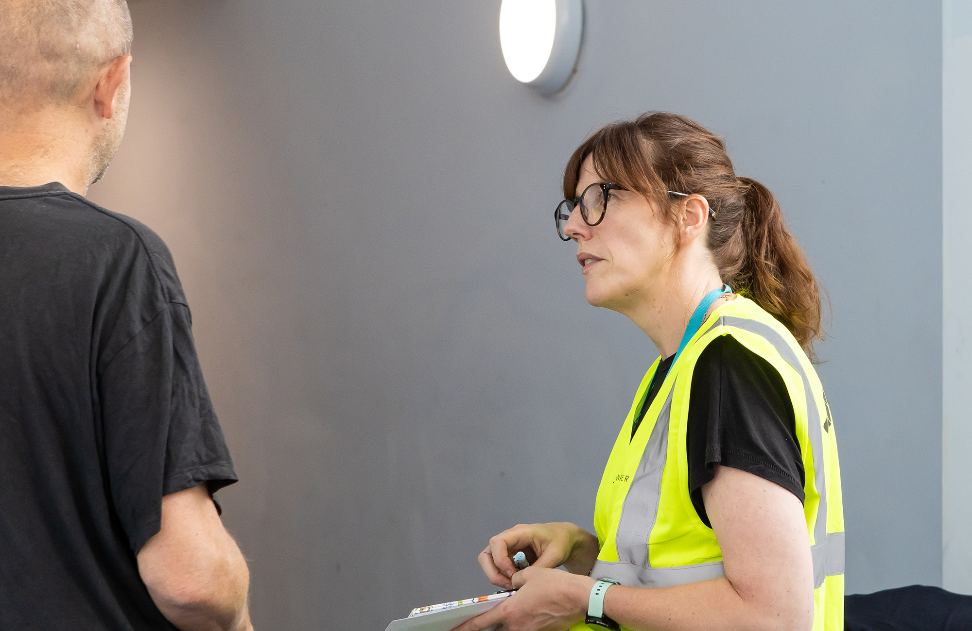 Man and a woman stood having a conversation
