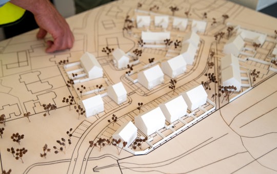 Development map with plastic houses