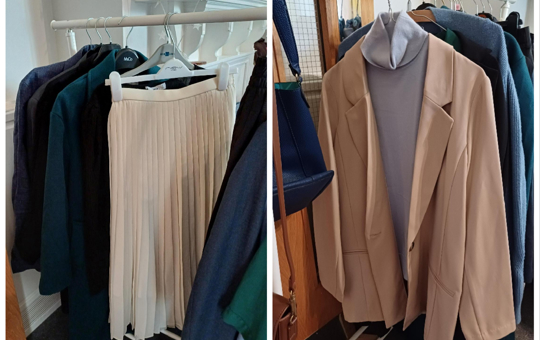 Clothing rail with items of clothing including a skirt and several coats
