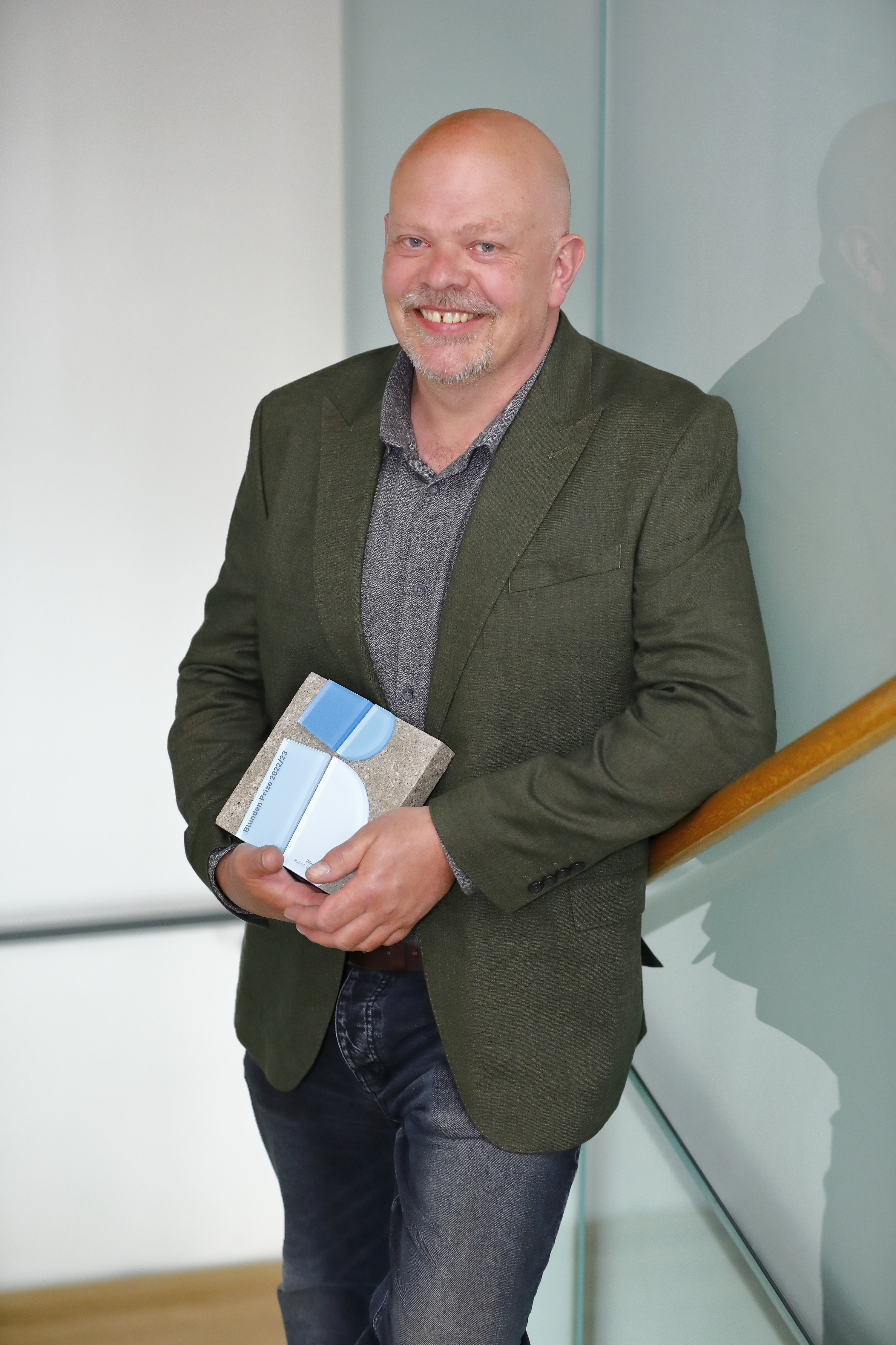 Blunden Prize winner Patrick Walls holding his award