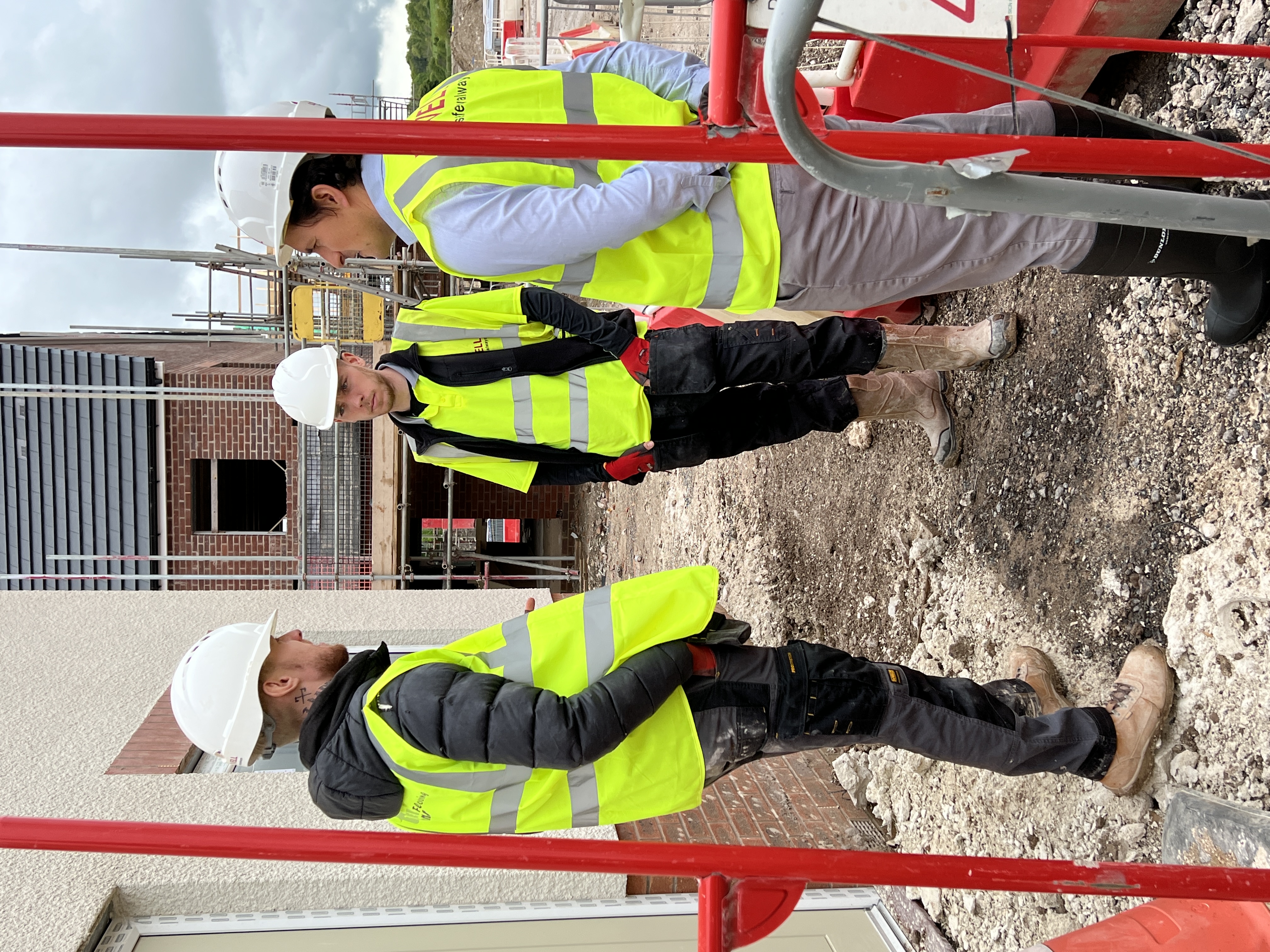 Veterans' Minister with two site workers