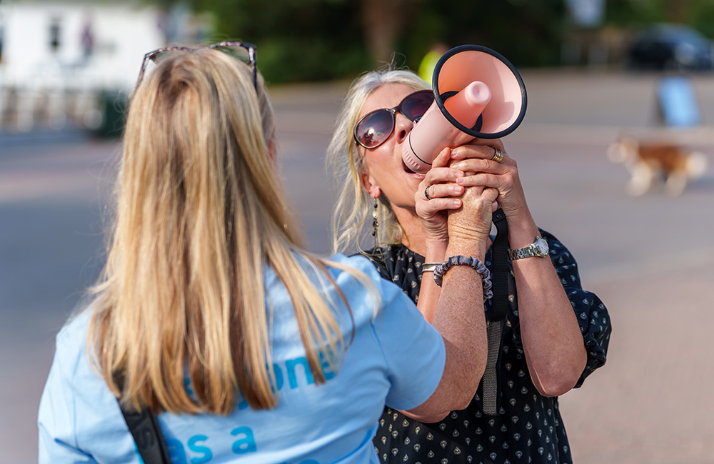 Two women with a megaphone.