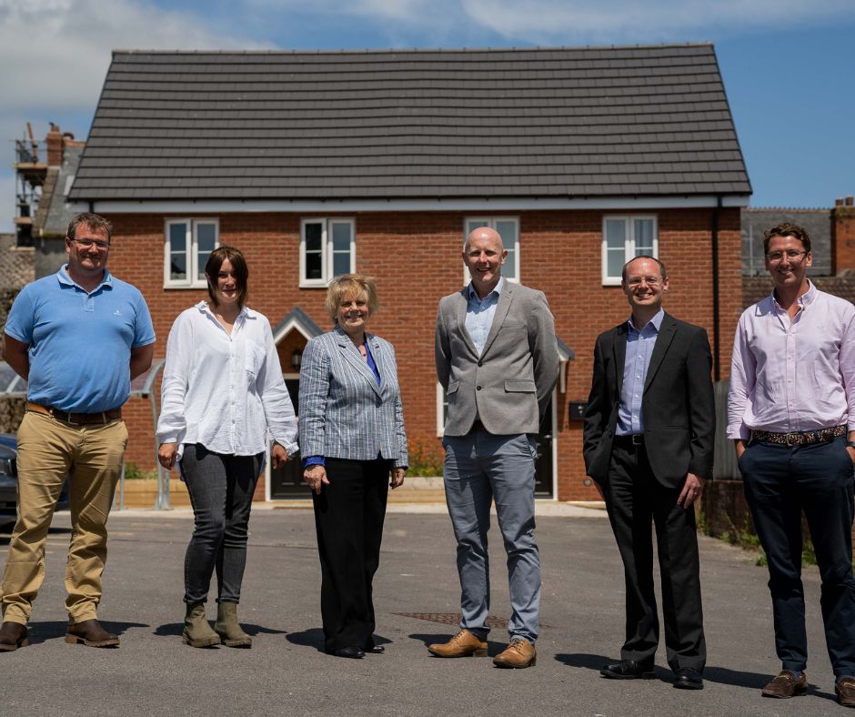 Stonewater and Beattie representatives stood outside Chard homes