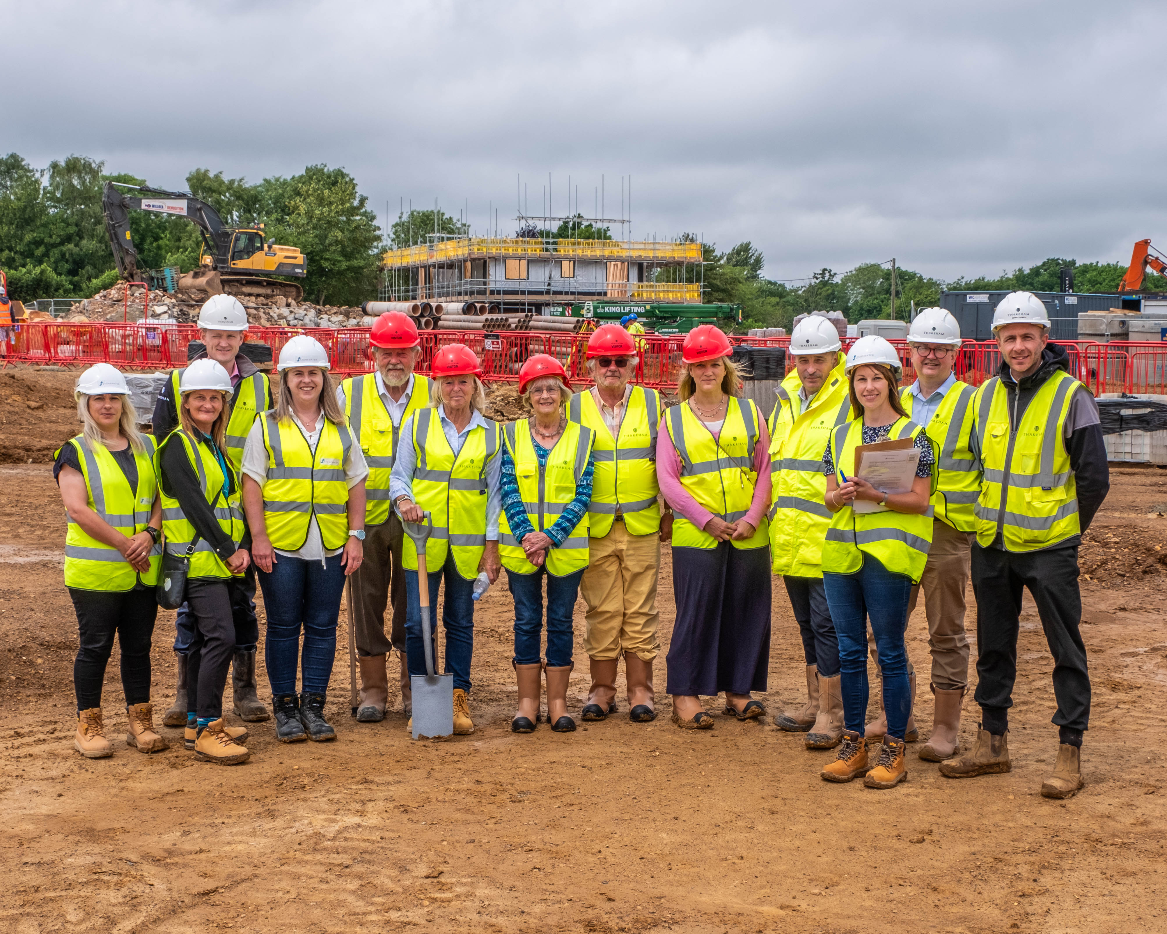 Group of colleagues and partners stood on Newick development site